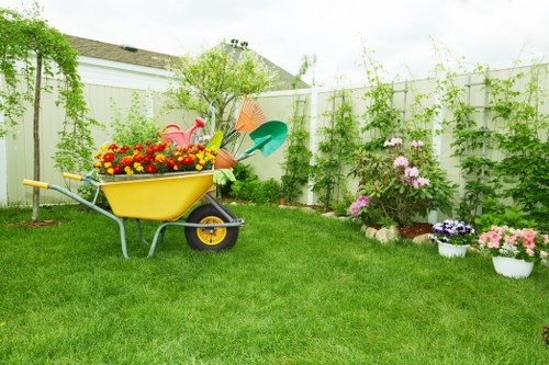 Professional landscapers planning a garden layout in Newham